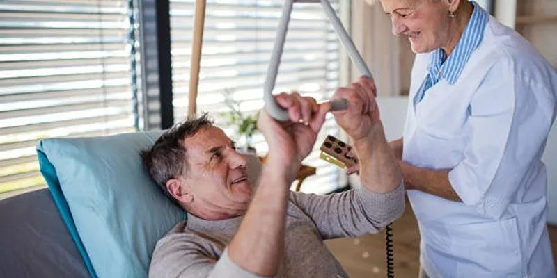 Senior using an adjustable bed