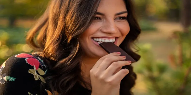 Chunks of dark chocolate on a wooden
board
