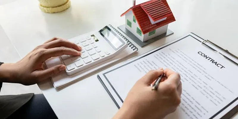Mortgage loan originator consulting with a
client