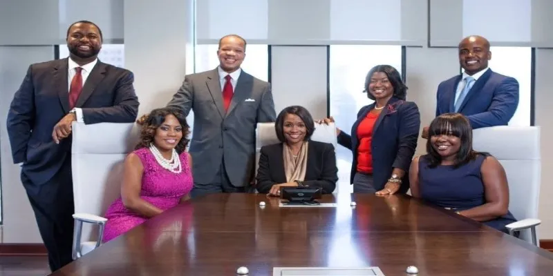 Black-owned bank ATM with community members