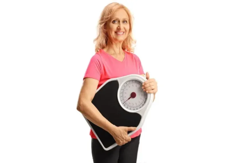 Woman practicing weight maintenance through healthy
eating