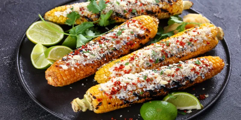 Tulum street food featuring tacos and
elote