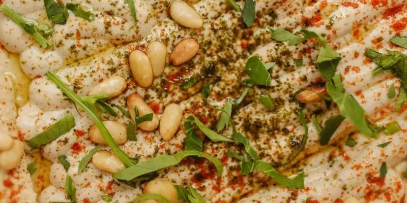 Pine nuts scattered on a wooden table
